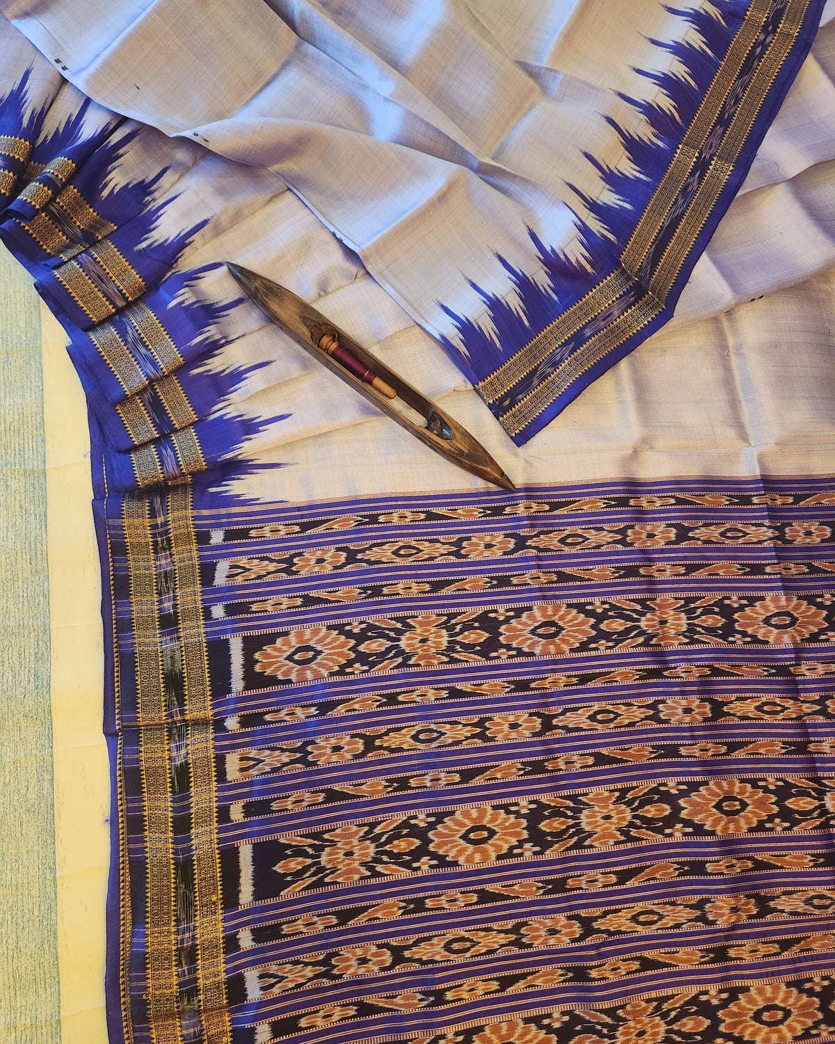 Saree with blue and gold border and patterned design