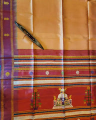 Traditional saree with intricate patterns and a decorative knife on a yellow and red background